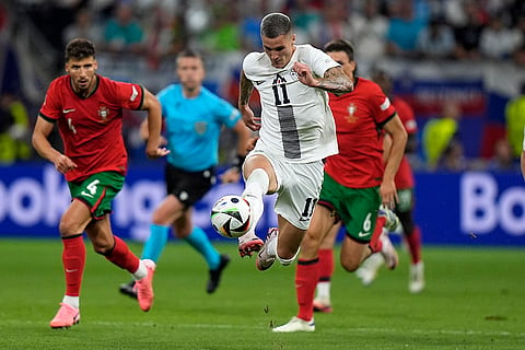 Slovenia's Benjamin Sesko controls the ball